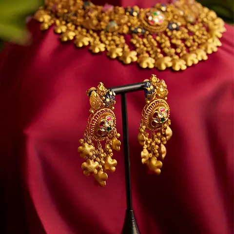 Gold earrings jhumkas